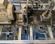 A test bench with electric motor, injector, cables and lines